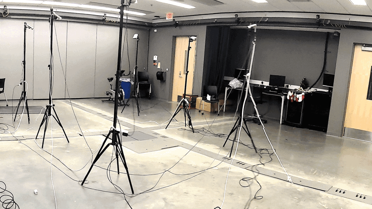 Sprinter with motion capture markers and metrics overlaid